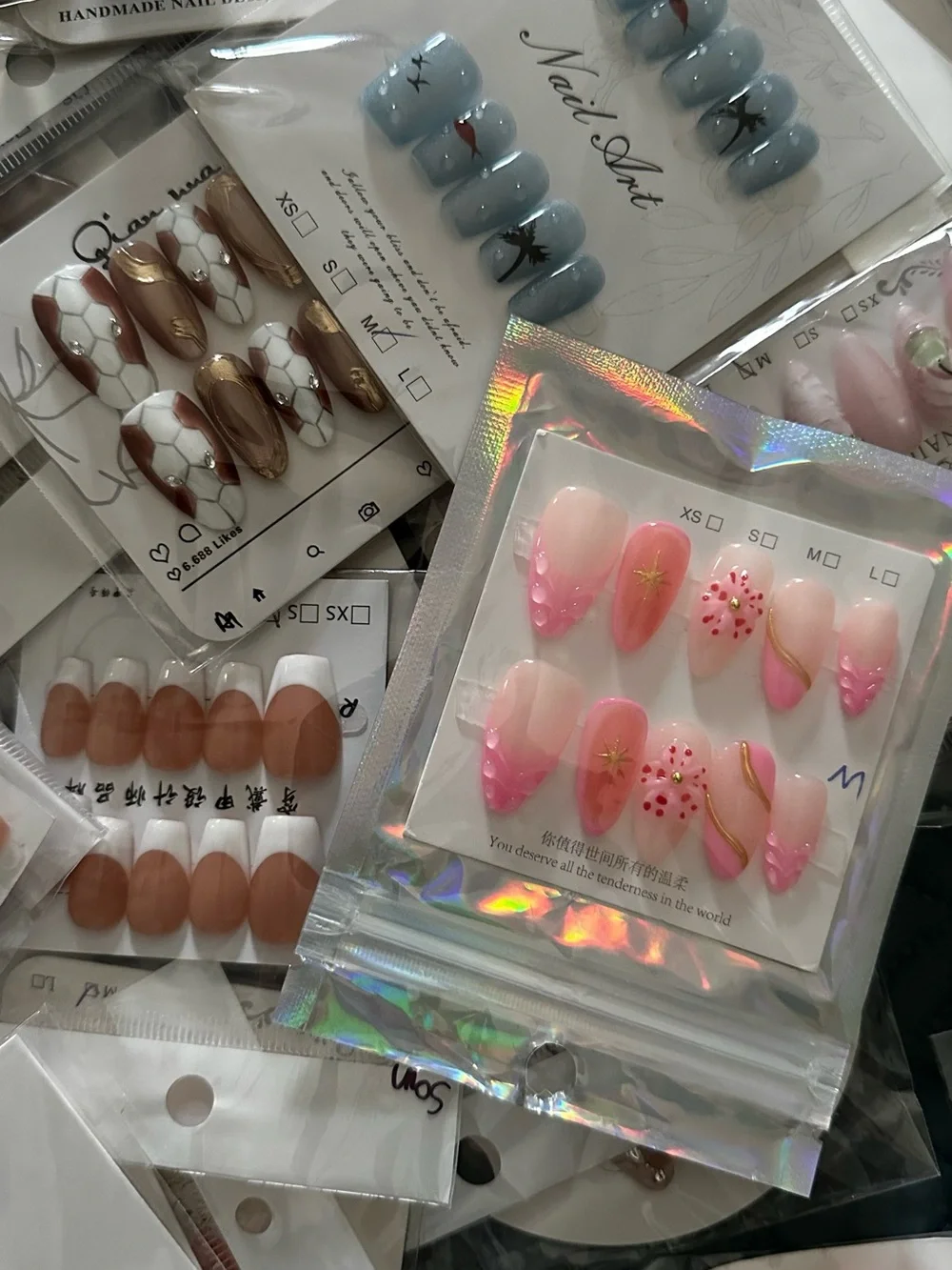 100 Sets of SURPRISE Assorted Press-On Nail Sets - Floral, Pink, Blue, Neutral